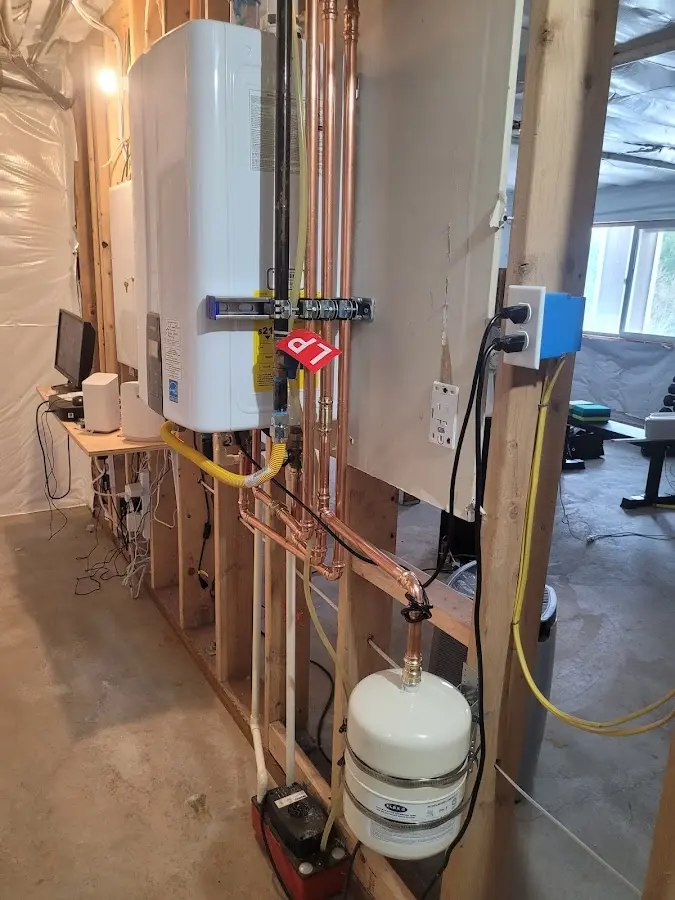 Licensed plumber repairing a kitchen sink in Calais